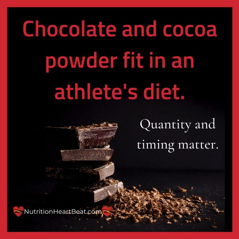 A stack of dark chocolate bars sit in a pile of cocoa and chocolate shavings. Text indicates that athletes can safely consume chocolate and cocoa powder and still perform.